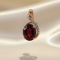 14K rose gold oval garnet and diamond pendant front view