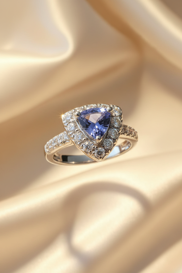 18K white gold trillion tanzanite and .36ctw diamond halo ring, front view