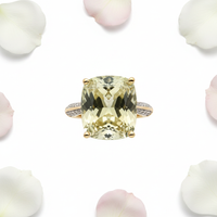 Lime quartz ring top down view with white and pink rose petals