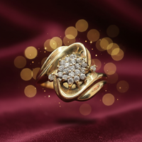 10K yellow gold diamond cluster swirl bypass ring luxury editorial marketing photo