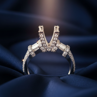 18K White Gold Baguette and Pavé V-Shank Cathedral Diamond Semi-Mount Engagement Ring on midnight blue silk backdrop editorial marketing image
