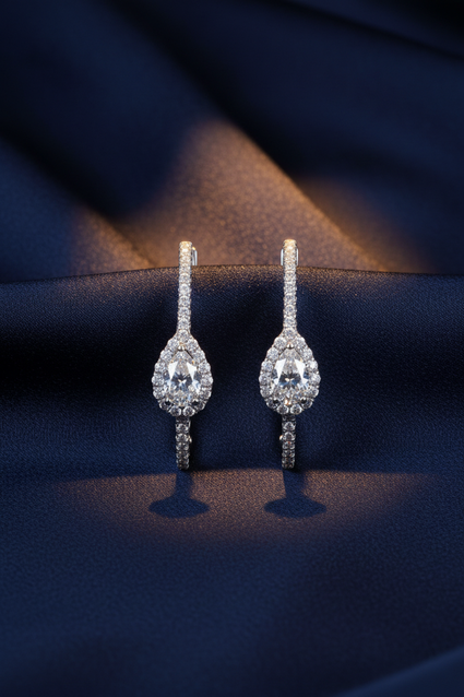 18K White Gold Pavé Diamond Full Hoop Lever-Back Earrings on midnight blue silk backdrop editorial marketing image