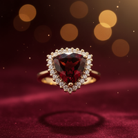 14K yellow gold trillion garnet diamond halo ring luxury editorial marketing photo