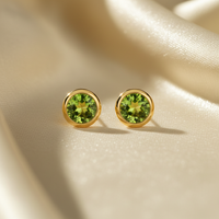 14K white gold round peridot bezel stud earrings 5mm - editorial marketing image 2
