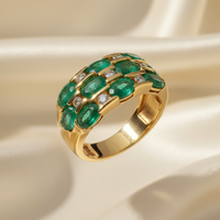 14K yellow gold three-row oval emerald and .16ctw diamond wide band ring, top-down view