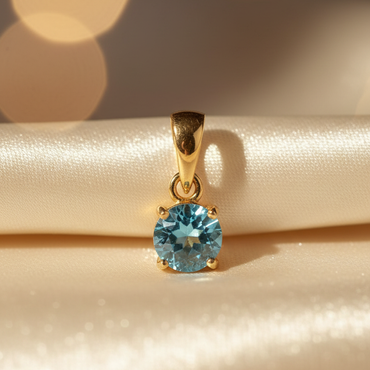 14K yellow gold round blue topaz solitaire pendant, front view