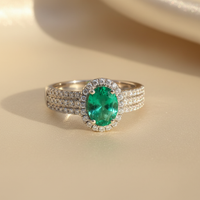 18K White Gold Oval Emerald & Diamond Halo Ring - editorial front elevated