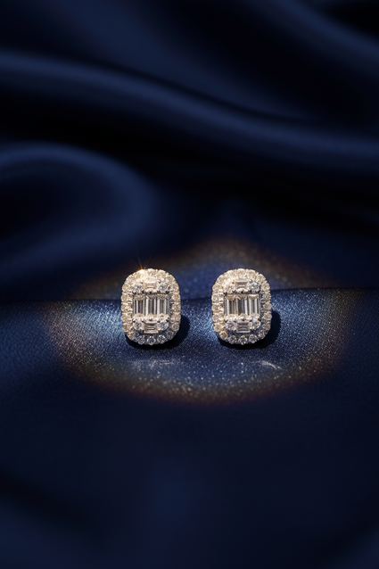 14K White Gold Diamond Cushion Baguette Cluster Halo Stud Earrings on midnight blue silk backdrop editorial marketing image