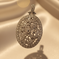 18K white gold .56ctw diamond art deco oval filigree locket, top-down view