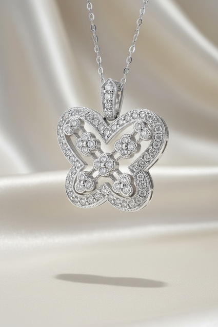 14K white gold 1/2ctw diamond Art Deco quatrefoil pendant - editorial marketing image