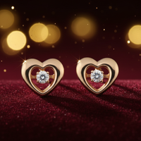 1/8 CTW Floating Diamond Heart Stud Earrings in 14K Two-Tone Yellow and Rose Gold