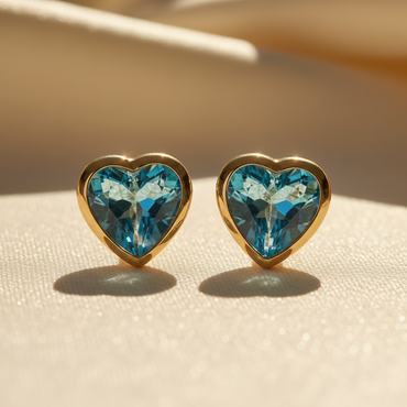 14K yellow gold heart blue topaz bezel stud earrings - editorial marketing image 1