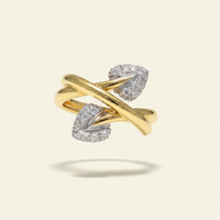 18K yellow gold diamond leaf cluster bypass ring floating on ivory backdrop luxury editorial marketing image
