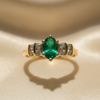 14K Yellow Gold Oval Emerald & Diamond Ring - editorial top down