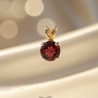14K two-tone gold round garnet pendant bail detail