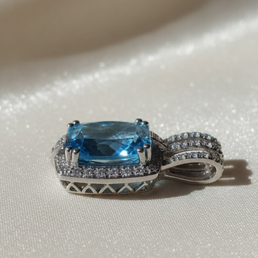 14K white gold cushion blue topaz and diamond halo pendant, side profile