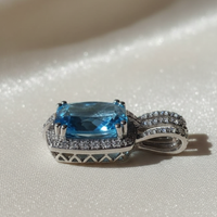 14K white gold cushion blue topaz and diamond halo pendant, side profile