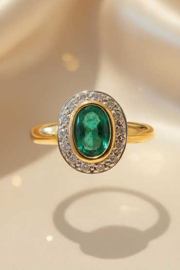14K yellow gold oval emerald bezel-set diamond pavé halo ring, front view