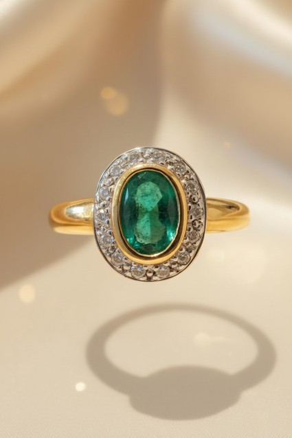 14K yellow gold oval emerald bezel-set diamond pavé halo ring, front view