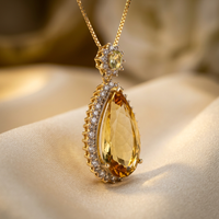 14K gold citrine and diamond pear pendant necklace, angled view