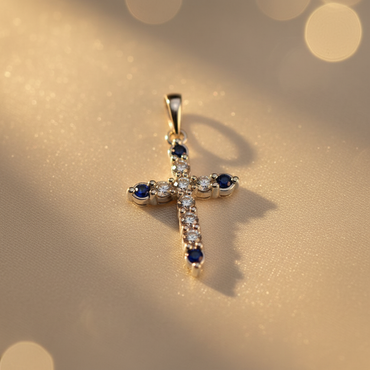 10K white gold cross pendant with alternating round brilliant diamonds and blue sapphires, angle 1