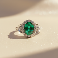 14K White Gold Oval Emerald & Diamond Halo Ring - editorial elevated front