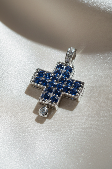 14K white gold blue sapphire and diamond cross pendant, three-quarter angle