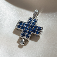 14K white gold blue sapphire and diamond cross pendant, three-quarter angle