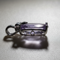 14K White Gold Cushion Amethyst and Diamond Bow Pendant - side profile on cream satin