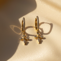 14K Yellow Gold 1/6ctw Diamond Cross Huggie Earrings - angle 2