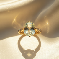 14K Yellow Gold Oval Olive Quartz Diamond Ring top view on cream satin