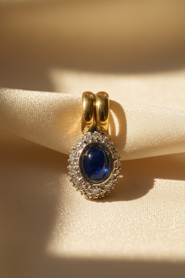18K Two-Tone Gold Blue Sapphire Cabochon & Diamond Halo Pendant - Marketing Image