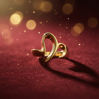 14K yellow gold abstract bypass ribbon ring luxury editorial marketing photo