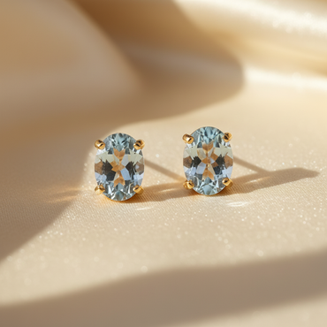 14K yellow gold oval aquamarine stud earrings - editorial marketing image 1