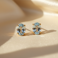 14K yellow gold oval aquamarine stud earrings - editorial marketing image 1