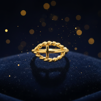 14K yellow gold rope circle cross ring luxury editorial marketing photo