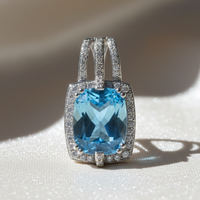 14K white gold cushion blue topaz and diamond halo pendant, front view