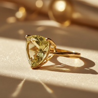 14K Yellow Gold Trillion Olive Quartz Ring three-quarter angle on cream satin