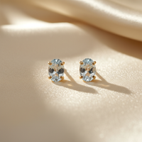 14K yellow gold oval aquamarine stud earrings - editorial marketing image 3