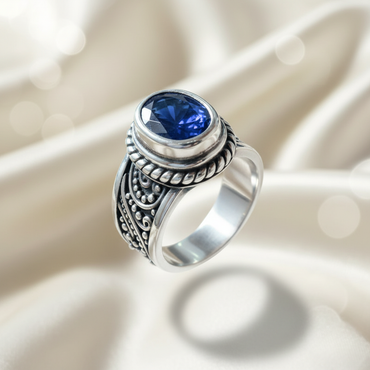 Sterling Silver Oval Blue Sapphire Bali Ring — angled three-quarter view