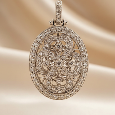 18K white gold .56ctw diamond art deco oval filigree locket, front view