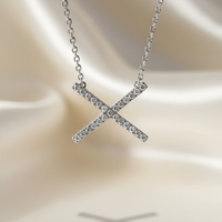 Diamond X pendant sterling silver editorial marketing image