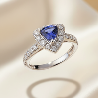 18K white gold trillion tanzanite and .36ctw diamond halo ring, elevated view
