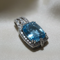 14K white gold cushion blue topaz and diamond halo pendant, three-quarter angle