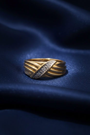 10K Yellow Gold Men's Two-Tone Diamond Crossover Ring on midnight blue silk backdrop editorial marketing image