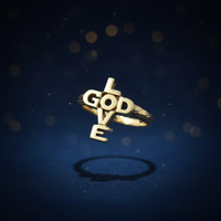 14K yellow gold GOD LOVE cross purity ring luxury editorial marketing photo